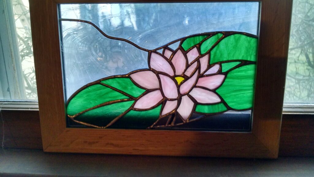 Stained glass water lily, in wooden frame