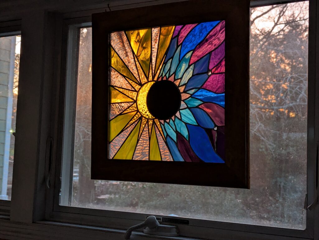 Eclipse stained glass with Herkimer diamonds for planets