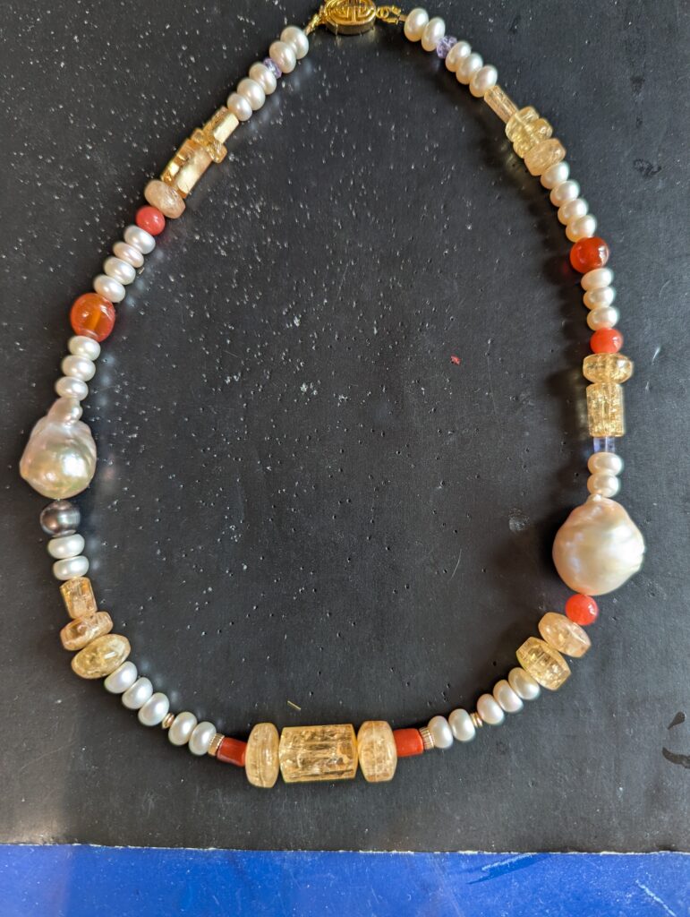 Imperial Topaz necklace with pearls and other beads.