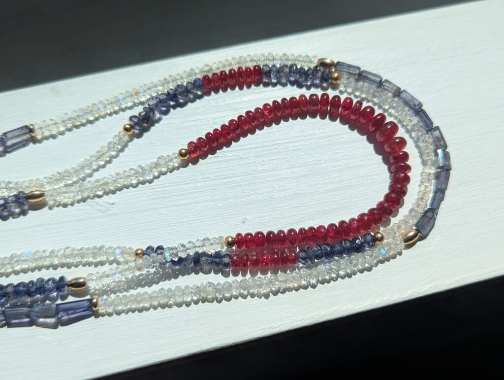 Bead necklace with red spinel, moonstone and Iolite.  